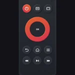 Giao diện ứng dụng Amazon Fire TV Remote trên điện thoại thông minh, hiển thị các nút điều khiển và bàn di chuột ảo.