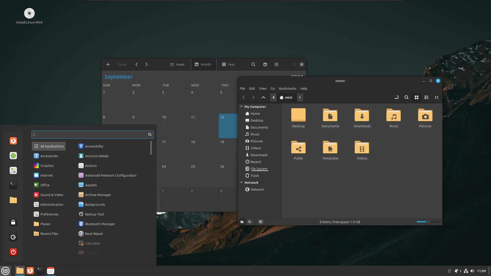 Màn hình desktop của Linux Mint với ứng dụng lịch và trình duyệt tệp đang mở, thể hiện một hệ điều hành Linux di động có thể mang theo trong Live USB.