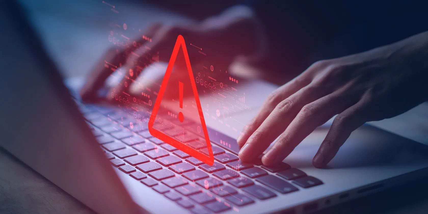 Người dùng nhìn vào màn hình laptop với cảnh báo an ninh mạng &quot;System Hacked&quot;, tượng trưng cho rủi ro khi câu hỏi bảo mật dễ đoán bị hacker khai thác.
