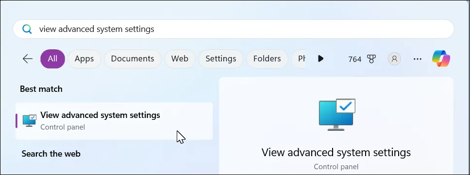 Thanh tìm kiếm trên Windows 11 với từ khóa "view advanced system settings" hiển thị kết quả cài đặt hệ thống